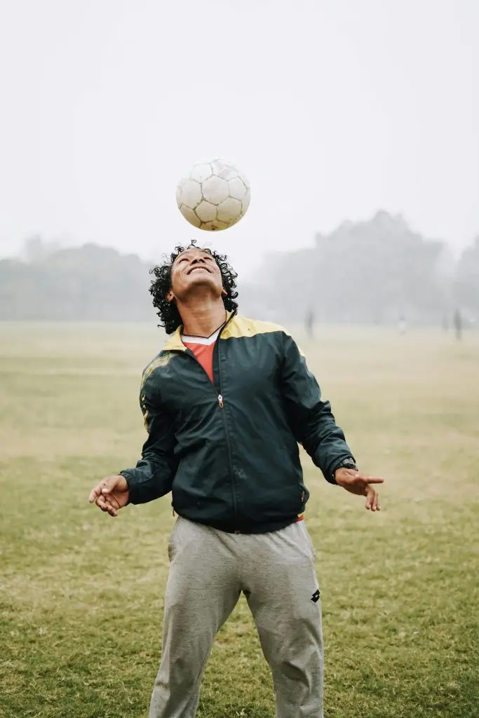 Man hitting ball with head. Photo by Yogendra Singh